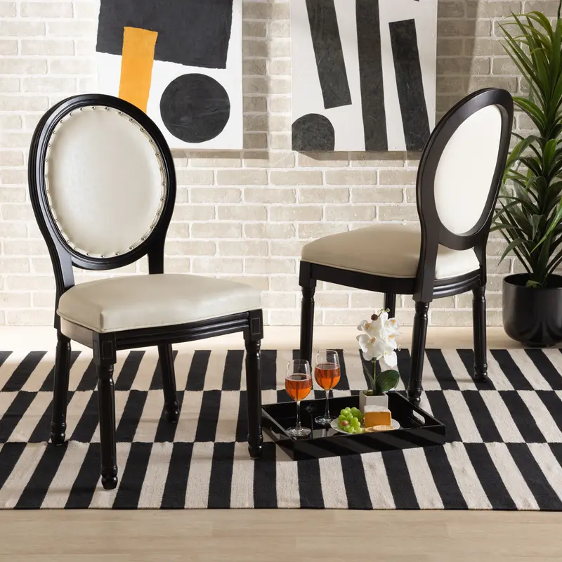Baxton Studio Louis Traditional French Inspired Beige Faux Leather Upholstered and Black Finished Wood 2-Piece Dining Chair Set